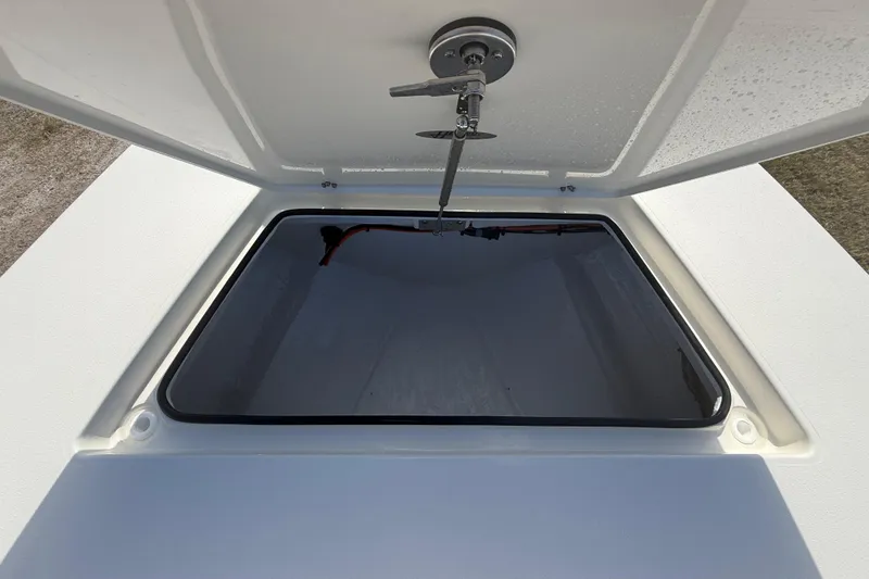 Slide: The Image of Open storage compartment on 2026 Hewes 18 Redfisher boat, showcasing interior space. - 31
