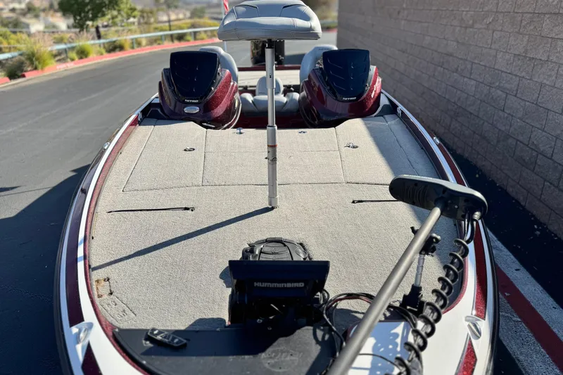 Slide: The Image of 2019 Nitro Z21 boat with fishing deck and equipment, parked outdoors. - 11