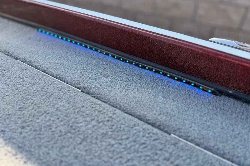 Slide: The Image of 2019 Nitro Z21 boat deck with blue LED lights and textured surface. - 14