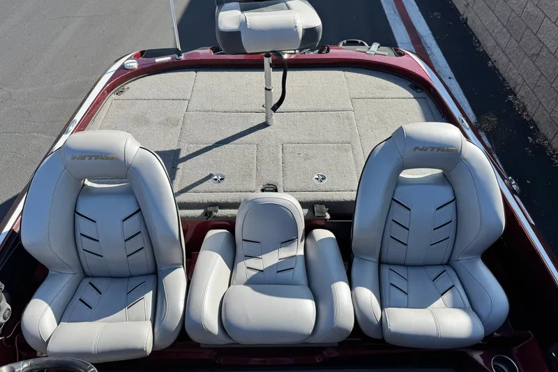 Slide: The Image of 2019 Nitro Z21 boat interior with three cushioned seats, featuring sleek design and branding. - 16
