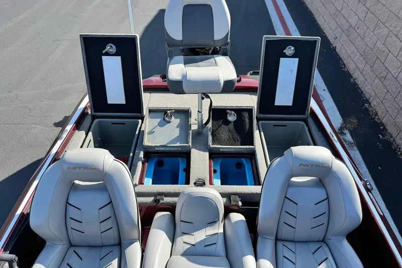 Slide: The Image of 2019 Nitro Z21 boat interior with open storage compartments and seating. - 17