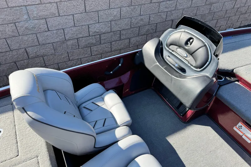 Slide: The Image of 2019 Nitro Z21 boat interior with gray seating and control panel. - 18