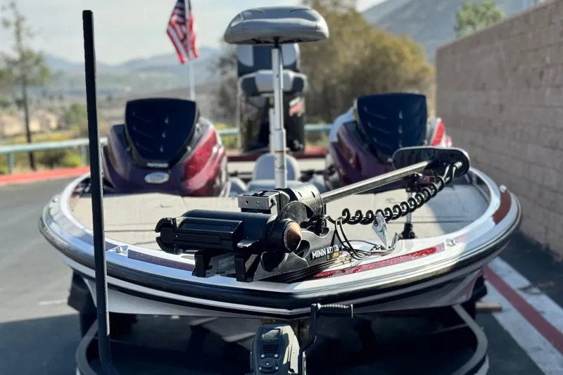 Slide: The Image of 2019 Nitro Z21 boat with Minn Kota trolling motor, parked outdoors. - 2