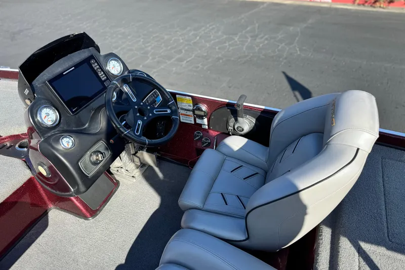 Slide: The Image of 2019 Nitro Z21 boat cockpit with steering wheel, gauges, and comfortable seating. - 20