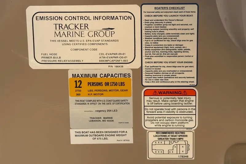 Slide: The Image of Safety and capacity labels on a 2015 Regency 250 LE boat, detailing emissions and warnings. - 13