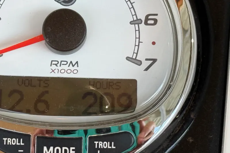 Slide: The Image of Close-up of a 2015 Regency 250 LE tachometer showing RPM, volts, and hours. - 14