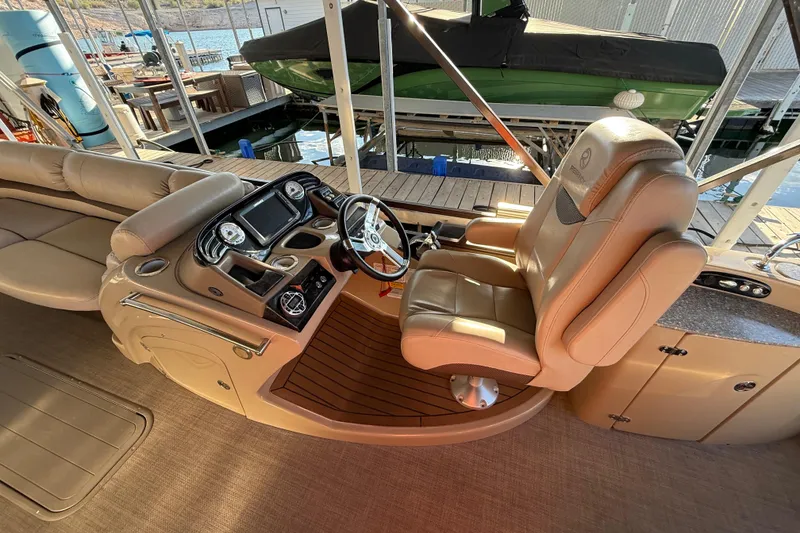 Slide: The Image of Luxurious 2015 Regency 250 LE boat interior with plush seating and modern dashboard. - 7