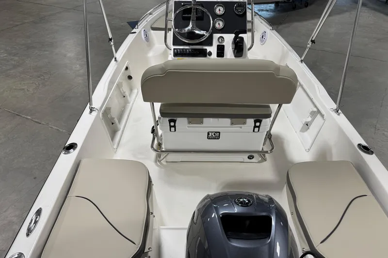 Slide: The Image of 2026 Key West 1720 Center Console boat interior with seating and control panel. - 12
