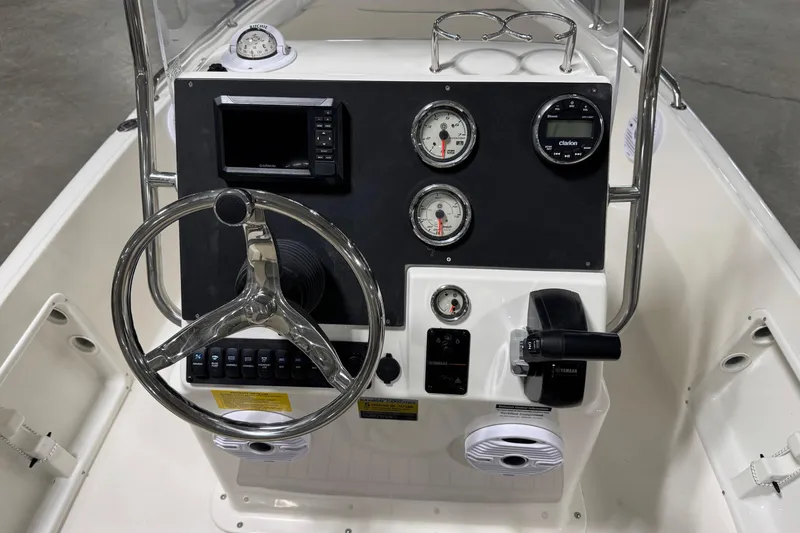 Slide: The Image of 2026 Key West 1720 Center Console boat dashboard with steering wheel and gauges. - 15