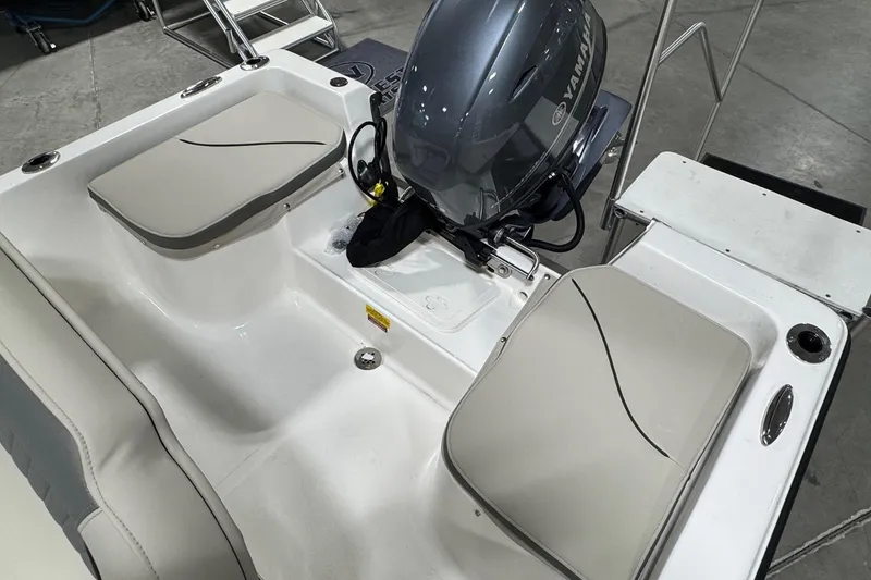 Slide: The Image of 2026 Key West 1720 Center Console boat with Yamaha engine, featuring cushioned seating. - 17