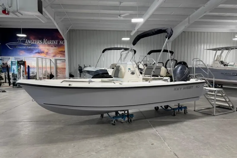 The Image of 2026 Key West 1720 Center Console boat displayed in a showroom. - 3