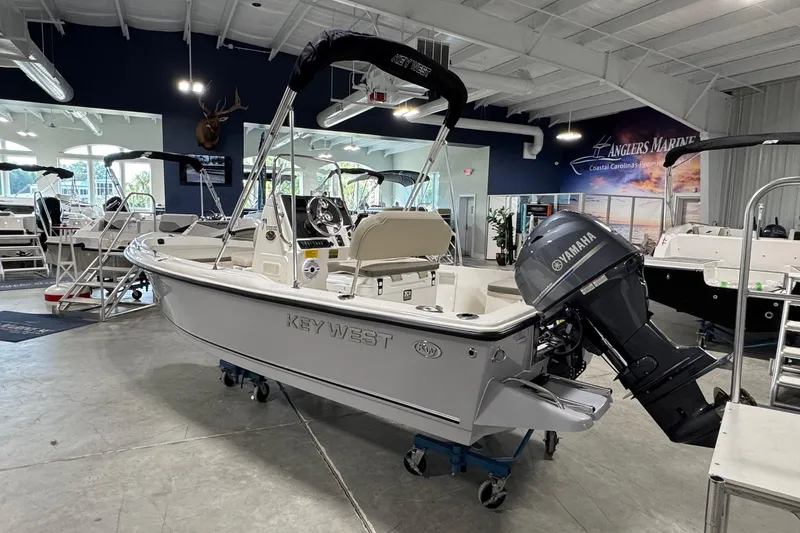 Slide: The Image of 2026 Key West 1720 Center Console boat in showroom with Yamaha outboard motor. - 5