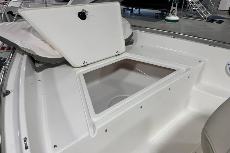 Slide: The Image of Open storage compartment on 2026 Key West 1720 Center Console boat. - 9