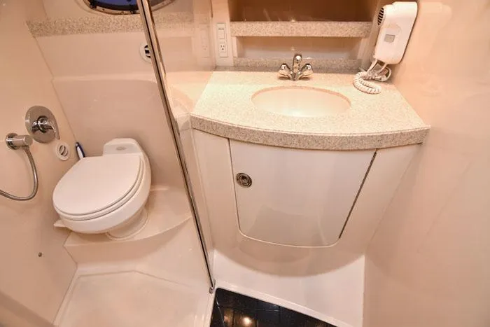 Slide: The Image of 2006 Regal Commodore 3560 yacht bathroom with sink, toilet, and shower. - 17