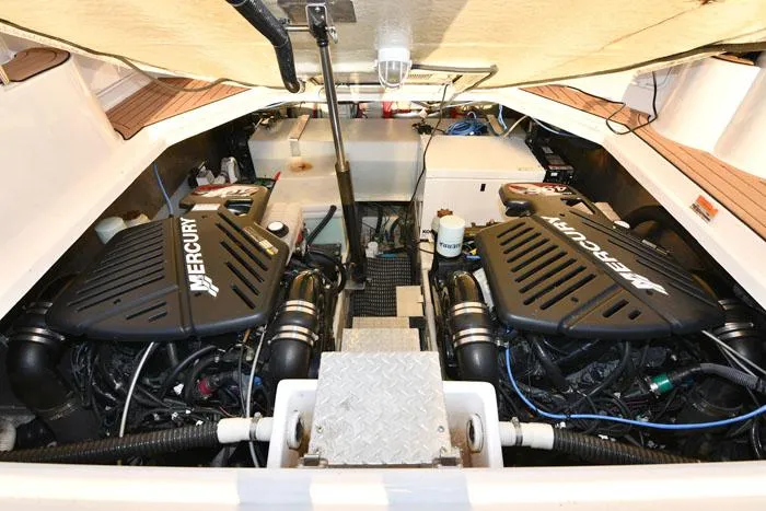 Slide: The Image of Engine compartment of 2006 Regal Commodore 3560 with dual Mercury engines. - 18