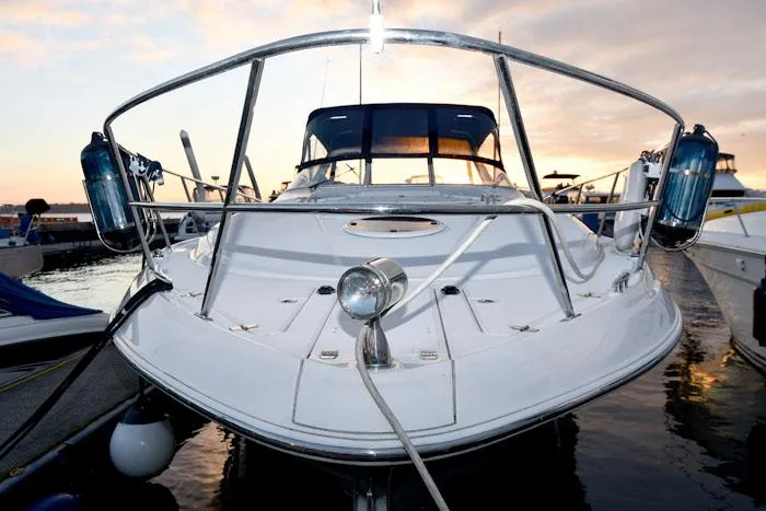 Slide: The Image of 2006 Regal Commodore 3560 yacht docked at sunset, front view. - 3