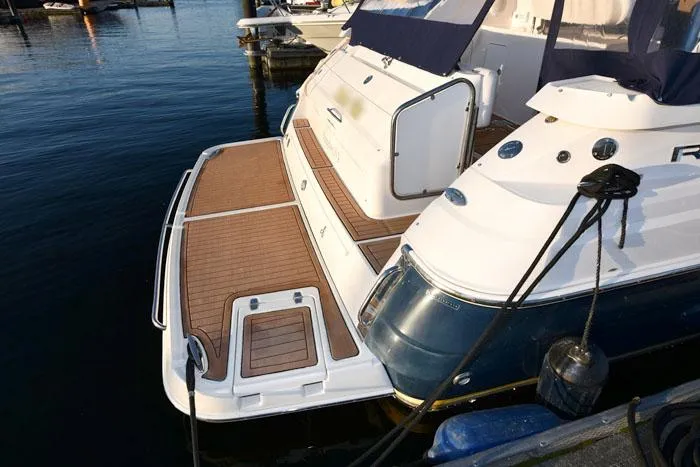 Slide: The Image of 2006 Regal Commodore 3560 yacht with wooden deck at marina. - 4