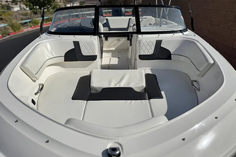 Slide: The Image of 2022 Bayliner VR6 Bowrider OB with spacious white seating and sleek design. - 10