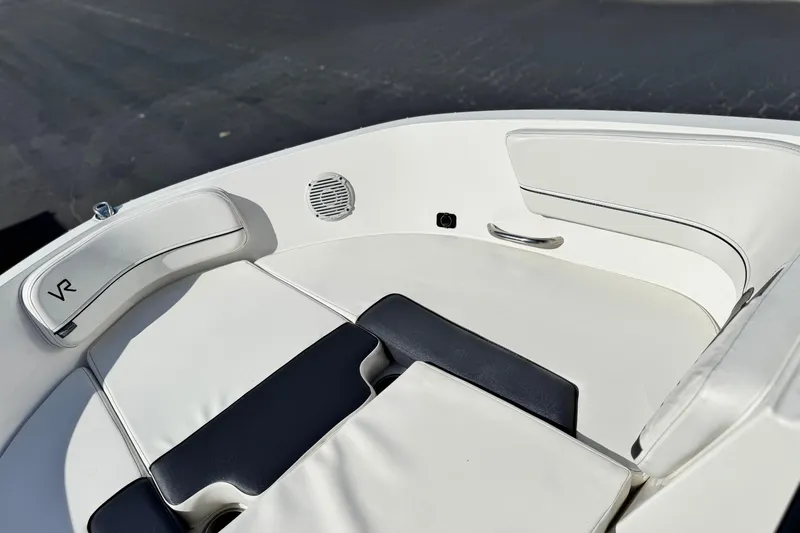 Slide: The Image of 2022 Bayliner VR6 Bowrider OB interior seating with white and black upholstery. - 13