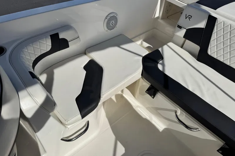Slide: The Image of 2022 Bayliner VR6 Bowrider OB interior seating with black and white upholstery. - 17