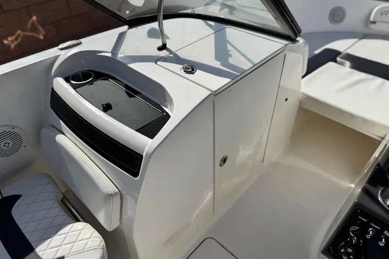 Slide: The Image of 2022 Bayliner VR6 Bowrider OB interior with seating and dashboard details. - 21