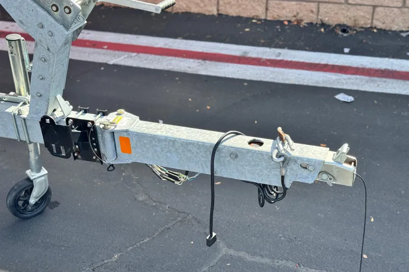 Slide: The Image of Trailer hitch of a 2022 Bayliner VR6 Bowrider OB on asphalt. - 26