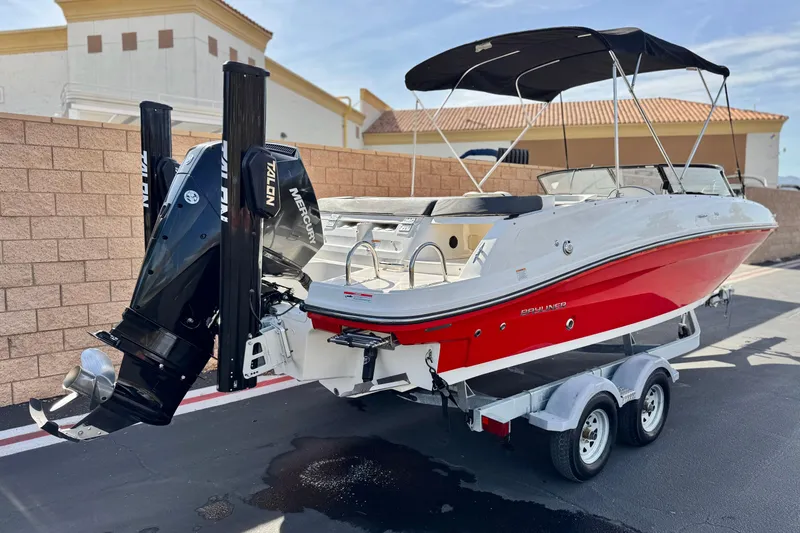 Slide: The Image of 2022 Bayliner VR6 Bowrider OB with Mercury outboard, red and white design, on trailer. - 5
