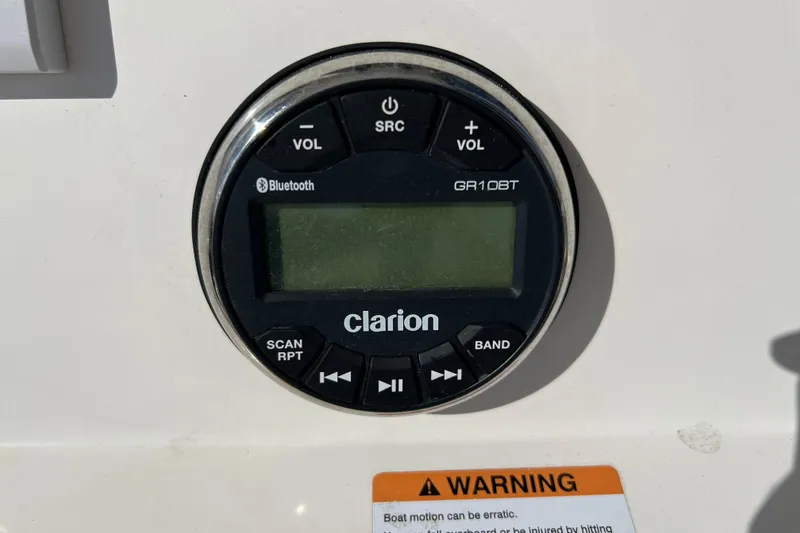 Slide: The Image of Clarion GR10BT audio system on 2024 Robalo 206 Cayman boat dashboard. - 14