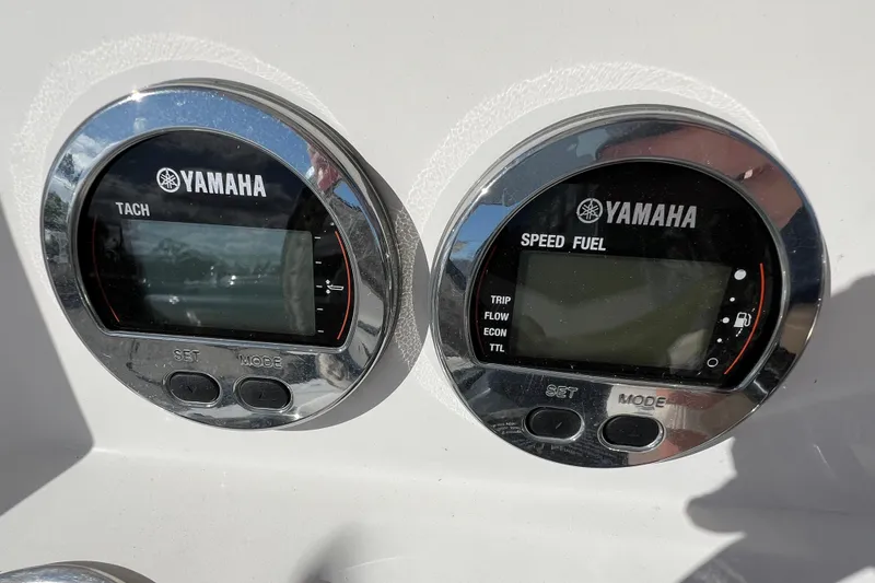 Slide: The Image of Yamaha tachometer and speed fuel gauges on 2024 Robalo 206 Cayman boat dashboard. - 15