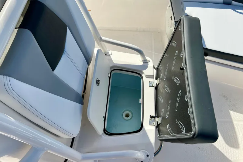 Slide: The Image of 2024 Robalo 206 Cayman boat seat with storage compartment open. - 19