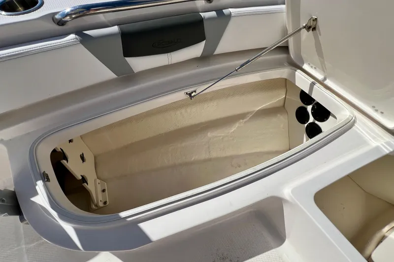 Slide: The Image of Open storage compartment on 2024 Robalo 206 Cayman boat, showcasing interior space. - 21