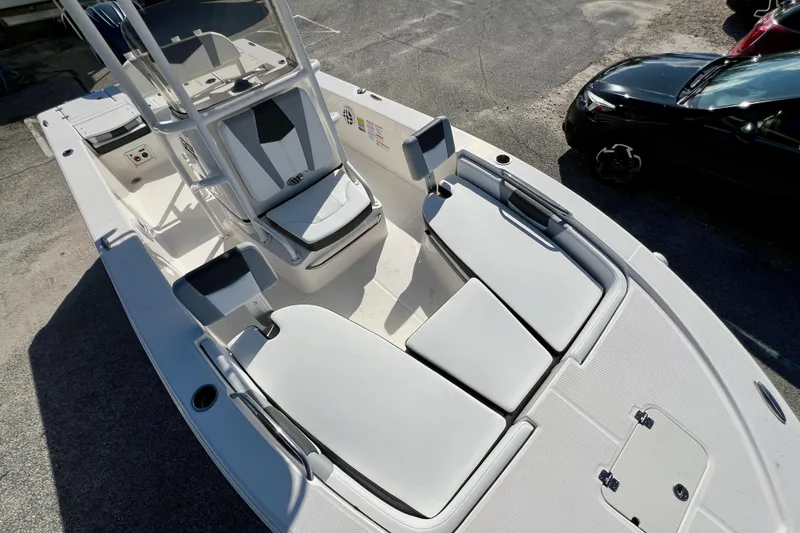 Slide: The Image of 2024 Robalo 206 Cayman boat interior with seating and storage compartments. - 24