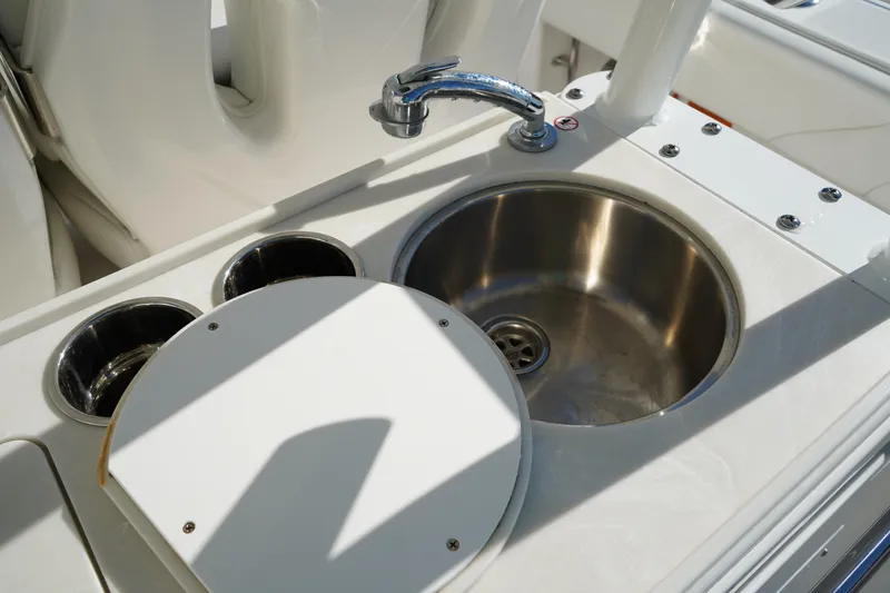 Slide: The Image of Edgewater 320CC 2021 boat sink and faucet with cup holders. - 20