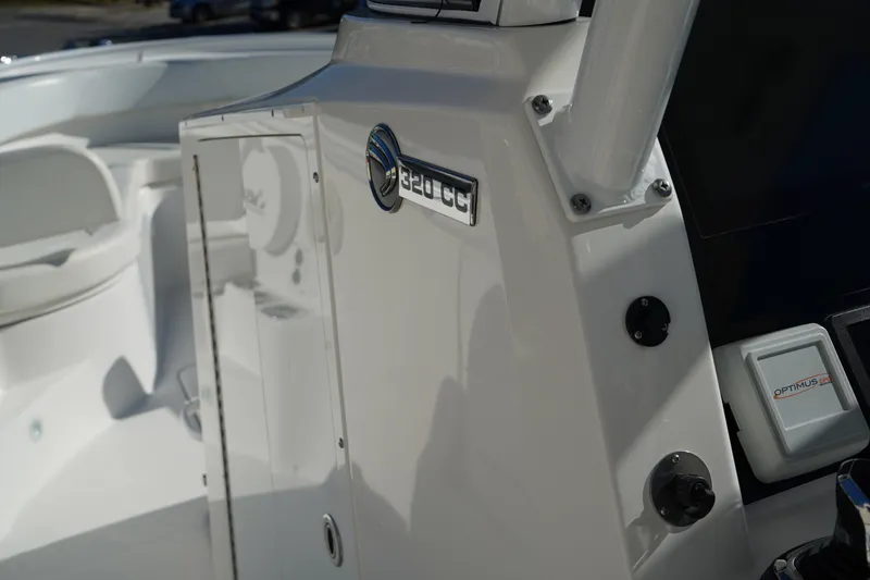 Slide: The Image of Edgewater 320CC 2021 boat console with Optimus control panel, sleek white design. - 29