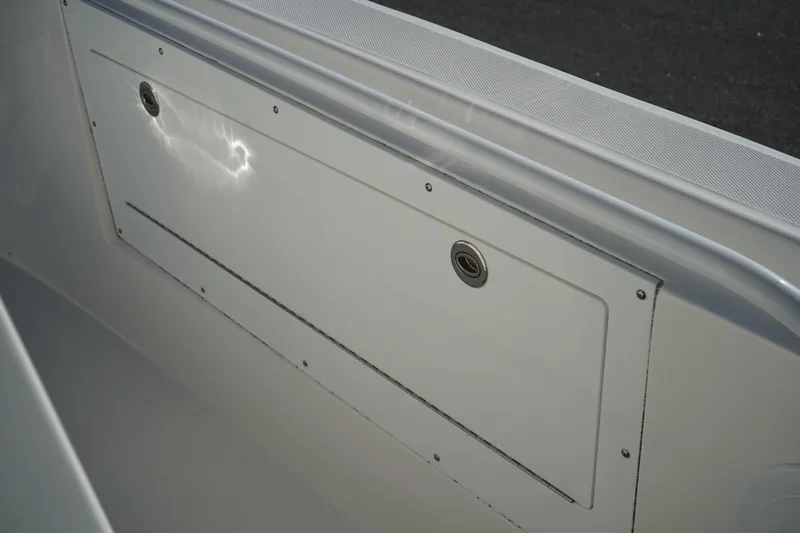 Slide: The Image of Edgewater 320CC 2021 boat interior detail with storage compartment. - 34