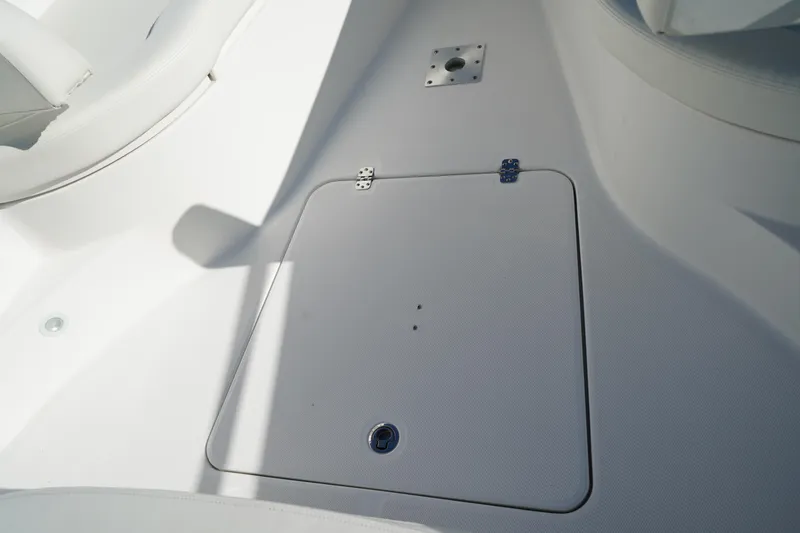 Slide: The Image of 2021 Edgewater 320CC boat deck with storage hatch and seating area. - 44