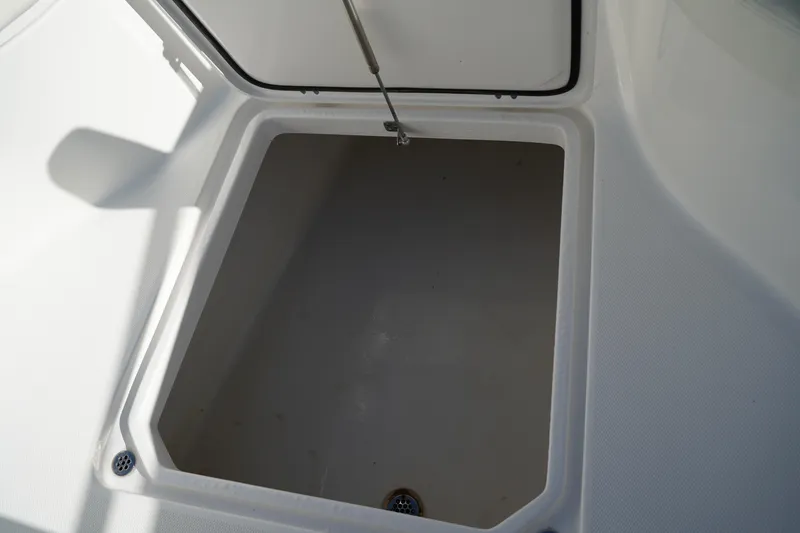 Slide: The Image of Open storage compartment on 2021 Edgewater 320CC boat, showcasing interior space. - 45
