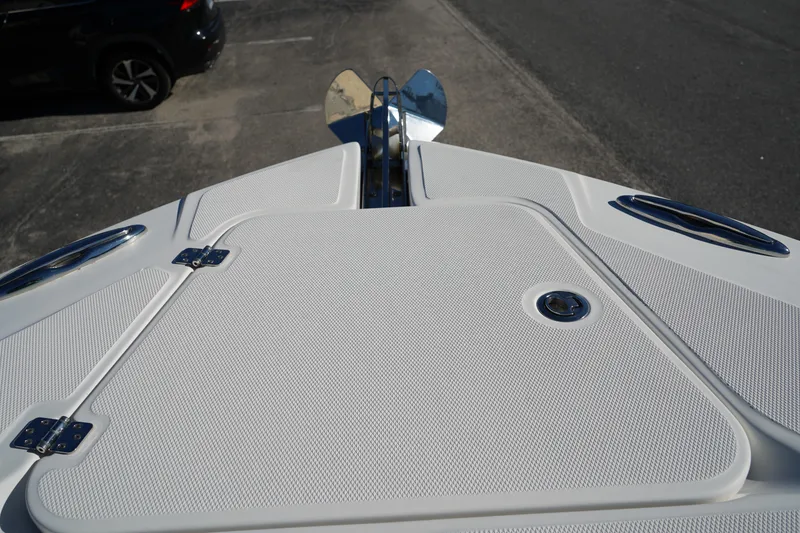 Slide: The Image of Bow of 2021 Edgewater 320CC boat with anchor and storage hatch. - 51