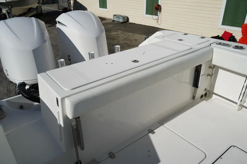 Slide: The Image of 2021 Edgewater 320CC boat deck with dual outboard engines, showcasing sleek design and functionality. - 8