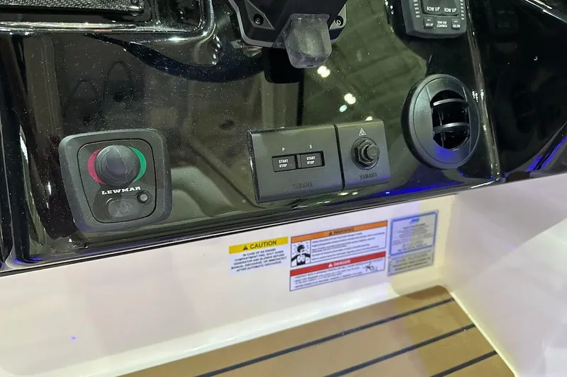 Slide: The Image of Control panel of 2026 Grady-White Express 340 boat with Lewmar and Yamaha controls. - 14