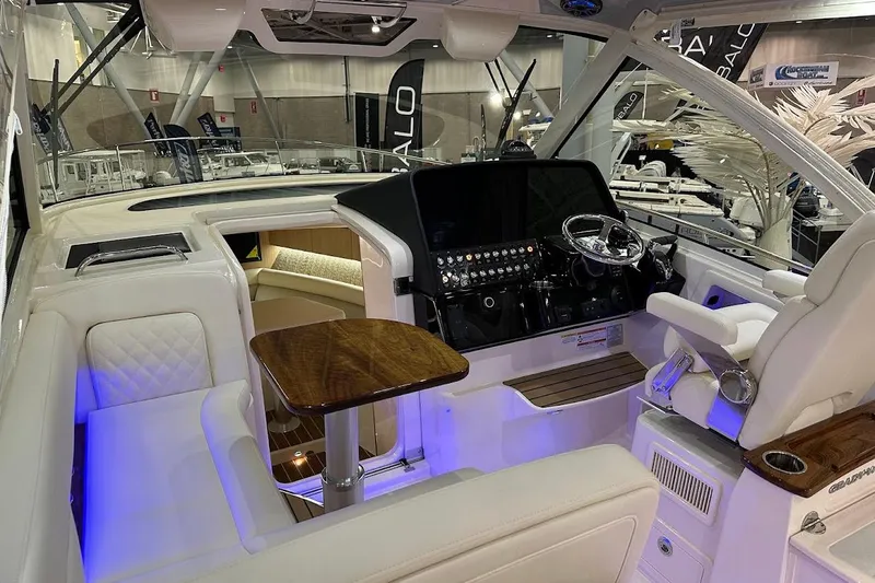 Slide: The Image of Interior of 2026 Grady-White Express 340 boat, featuring luxurious seating and modern controls. - 16