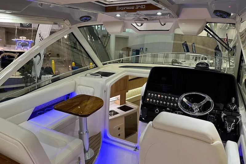 Slide: The Image of 2026 Grady-White Express 340 boat interior with modern helm and seating area. - 17