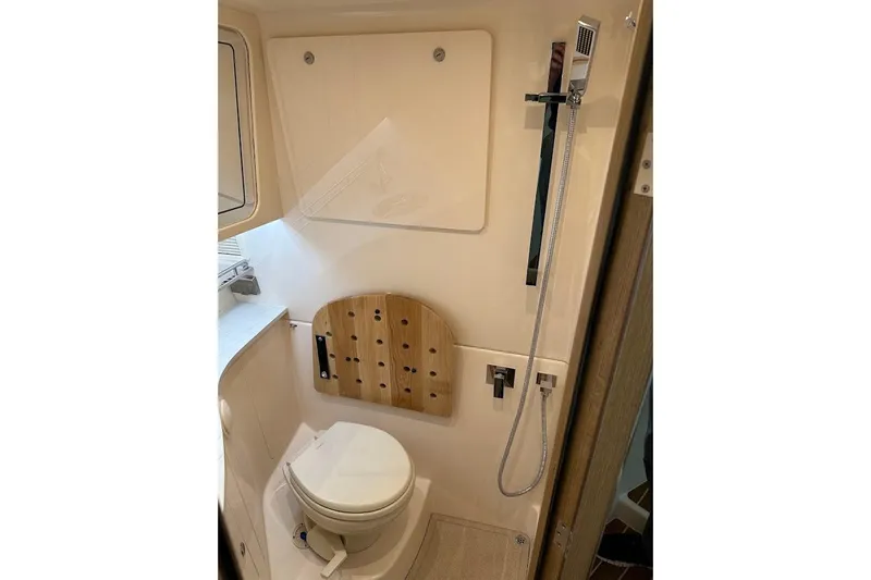 Slide: The Image of 2026 Grady-White Express 340 boat bathroom with shower and toilet. - 23