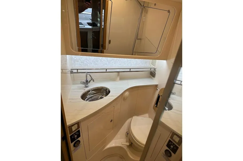Slide: The Image of Luxurious bathroom interior of 2026 Grady-White Express 340 boat with modern fixtures. - 24