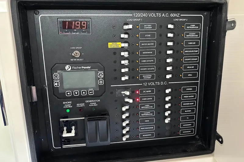 Slide: The Image of Electrical control panel on 2026 Grady-White Express 340 boat, featuring various switches and indicators. - 29