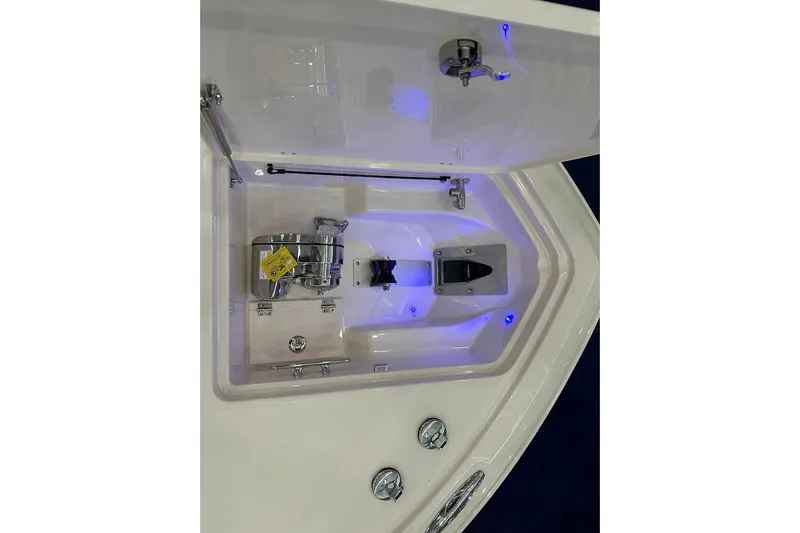 Slide: The Image of 2026 Grady-White Express 340 boat compartment with blue LED lighting and stainless steel fixtures. - 35