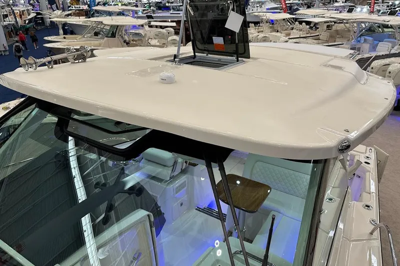 Slide: The Image of 2026 Grady-White Express 340 boat interior at a boat show, showcasing modern design features. - 36