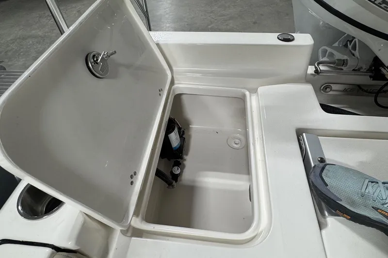 Slide: The Image of Open storage compartment on 2026 Key West 188 Bay Reef boat, showcasing interior space. - 16