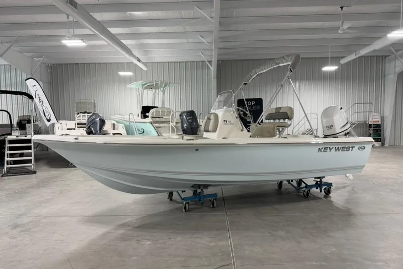 The Image of 2026 Key West 188 Bay Reef boat displayed in a showroom. - 1