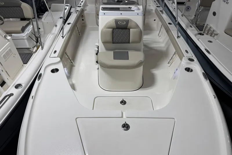 Slide: The Image of 2026 Key West 188 Bay Reef boat interior with seating and console. - 5